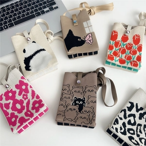 Mini knitted crossbody phone bags with cute animal patterns and floral designs