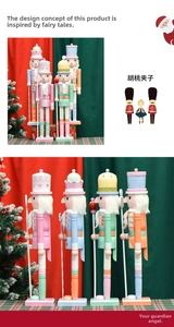 Detail of macaron colored wooden nutcracker soldiers with glitter hats and festive pedestals