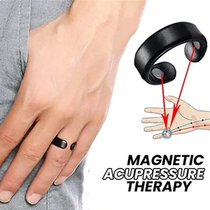Macro view of black magnetic acupressure therapy ring with internal magnet detail