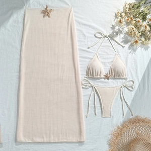 Three-piece cream bikini set featuring mesh long skirt and starfish buckle details