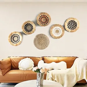 Set of 6 bohemian woven seagrass wall plates with black and orange geometric patterns