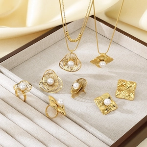 Elegant gold stainless steel jewelry set with pearls including necklaces, earrings and rings