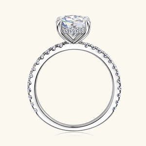 Elegant 2 carat round moissanite ring with four-prong setting and micro-paved silver band