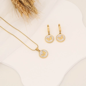 Elegant gold stainless steel butterfly necklace and earring set on white display