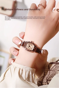 Detailed close-up of retro tonneau-shaped watch with genuine leather strap on wrist
