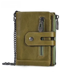 Detailed view of green genuine leather vintage wallet with metal zippers and chain strap
