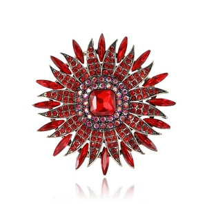 Elegant sunflower brooch featuring vibrant red rhinestones and crystals on a gold alloy base