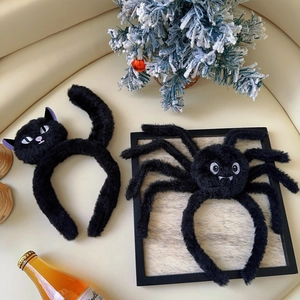 Detail view of plush Halloween headbands featuring black cat and spider designs