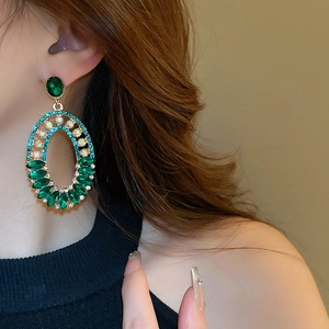 Vintage green crystal oval earrings with silver needles and luxury rhinestone design