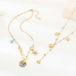 Golden stainless steel ocean necklace with starfish, seahorse pendants and pearls