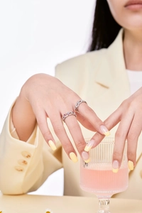 Detailed view of S925 sterling silver colorful zircon rings worn by a model