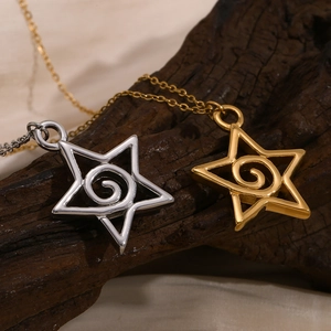 Detail of silver and gold star pendants with spiral texture on high-quality metal chains