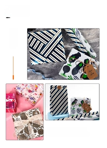 Premium gift wrapping paper rolls with diverse floral and striped patterns for holidays and birthdays.