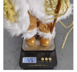 Measurement photo showing the 18 inch standing Santa doll weight at 426.7g on a scale