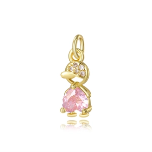 Close-up of 18k gold turtle pendant with pink heart gemstone and zircon crystals