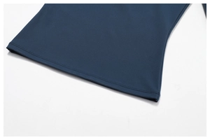 Macro shot of double-needle coverstitch hem on dark blue compression yoga wear