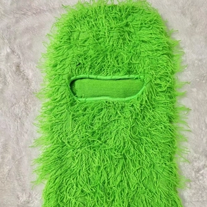 Detailed view of neon green fuzzy balaclava with long faux fur texture and single eye hole