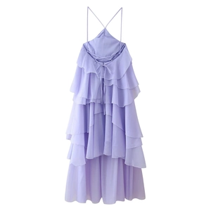 Detail of light purple tiered ruffle dress featuring a backless cross strap design