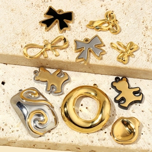 French style titanium steel pendants featuring bowknot and bear shapes on beige stone