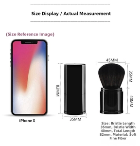 Detailed size comparison of the portable retractable powder brush with an iPhone X