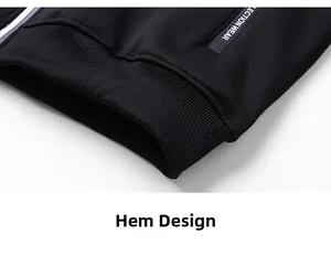 Detail of black jacket with ribbed elastic hem and SECTION WEAR print on zipper pocket
