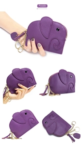 Detail of purple elephant coin purse in litchi leather with gold zipper and keychain