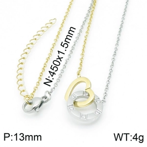 Detail of two-tone interlocking heart and crystal-studded ring pendant on dainty chain