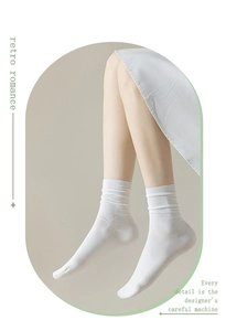 White cotton mid-tube socks detail view, soft and breathable fabric, comfortable daily wear.
