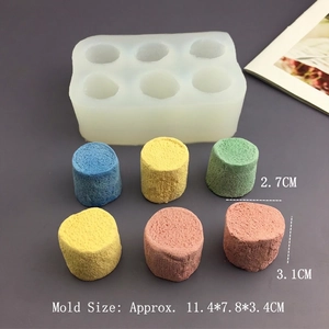 Detailed view of 6-hole silicone mold for making colorful cylindrical cat paw marshmallow treats