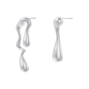Macro shot of liquid metal earrings with polished chrome finish and irregular wavy design