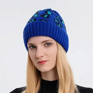 Winter women's leopard print knit beanie in dark blue with wide ribbed brim and warm texture