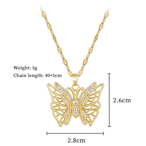 Macro detail of gold butterfly pendant with cubic zirconia and chain measurements