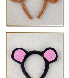 Detail showing plush mouse ear headbands in brown and pink colors with soft textures