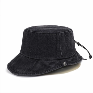 Detail of adjustable drawstring and logo label on a black denim bucket hat back view