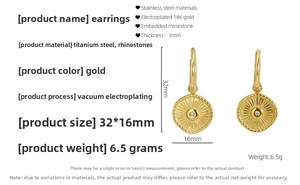 Macro detail of gold 18K plated compass earrings with zircon and measurements