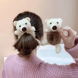 Cute cream white plush bear hair scrunchie shown in a stylish ponytail hairstyle