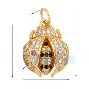 Macro detail of ladybug pendant with gold plating and sparkling cubic zirconia pavé