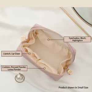 Premium small pink leather cosmetic bag with gold zippers and organized interior storage