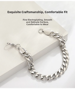 Close-up of silver curb chain bracelet with lobster clasp and high-polish electroplated finish