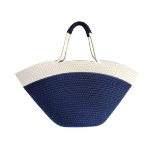 Large woven tote bag in navy blue and cream white cotton rope for summer beach vacation
