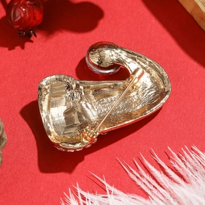 Detailed back view of golden alloy Christmas hat brooch with secure pin clasp mechanism