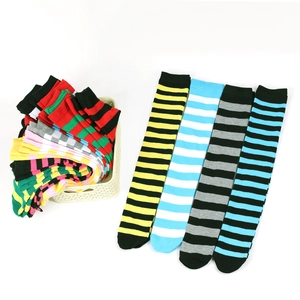 Macro view of striped over-the-knee socks showing assorted color patterns and knit texture