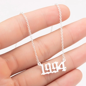 Detailed view of silver stainless steel 1994 birth year number pendant necklace