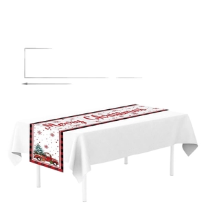 Christmas table runner with red truck, pine tree and snowflakes on red plaid border