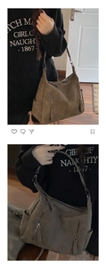 Detail of vintage brown suede tote bag featuring a decorative metal zipper and side pockets