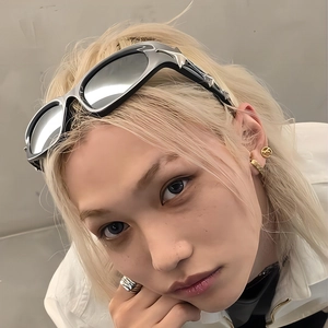 Futuristic square star sunglasses worn by a male model with a tech-style aesthetic