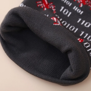 Kids Halloween knitted beanie featuring grey jacquard spider pattern and ribbed cuff texture