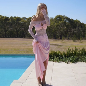 Detail of elegant pink lace off-shoulder bodice and silky draped slit skirt on model