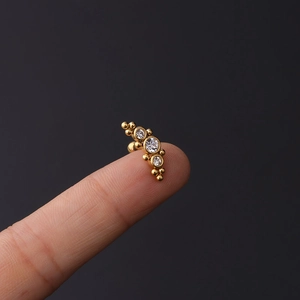16g gold stainless steel tragus earring with three curved cubic zirconia stones