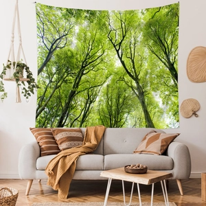 Detail of forest tapestry showing lush green tree canopy in a minimalist living room